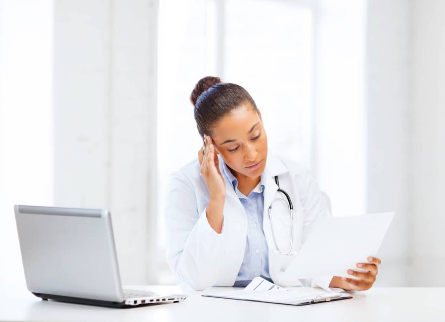 Physician Reviewing Paperwork