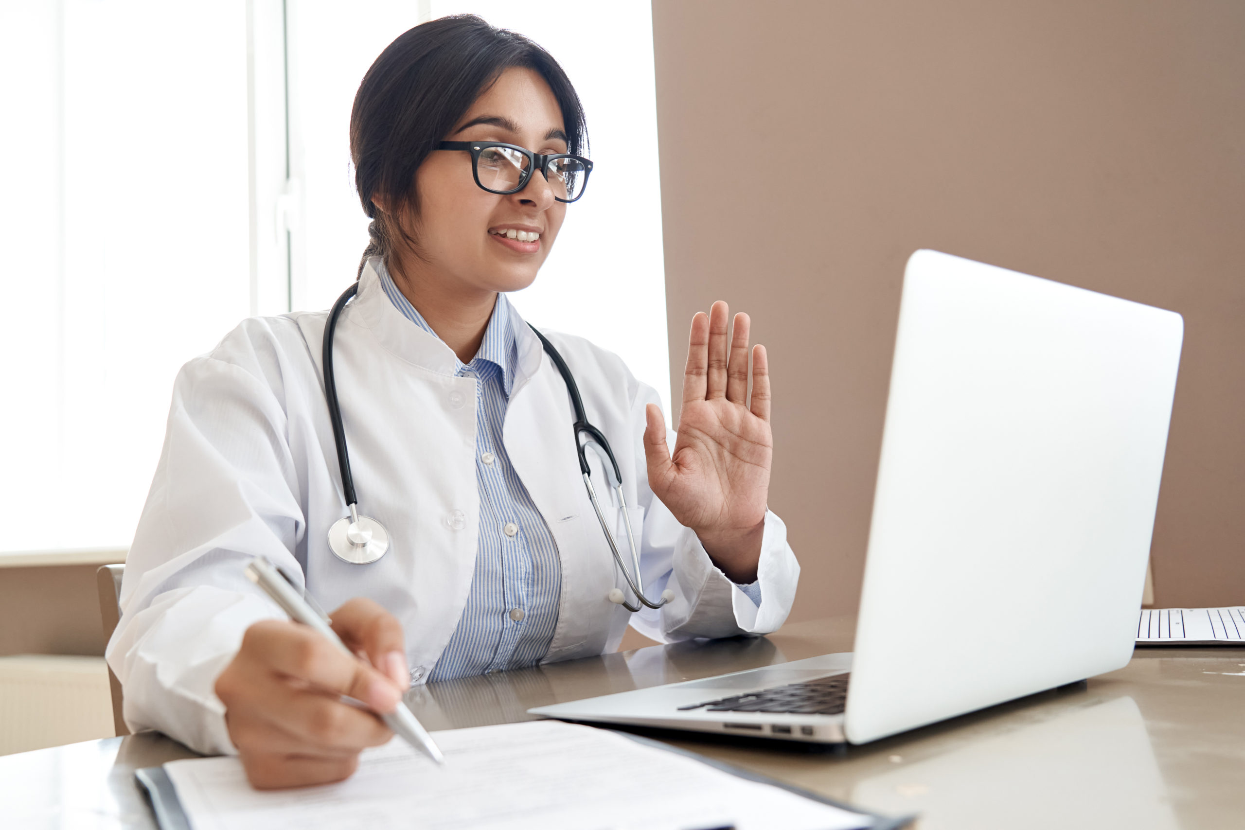 Female Neurologist consulting patient over telehealth visit.
